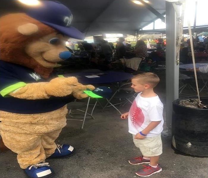 Young boy meeting Jake the Lion