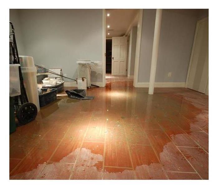 Residential Finished Basement with flooded floor 