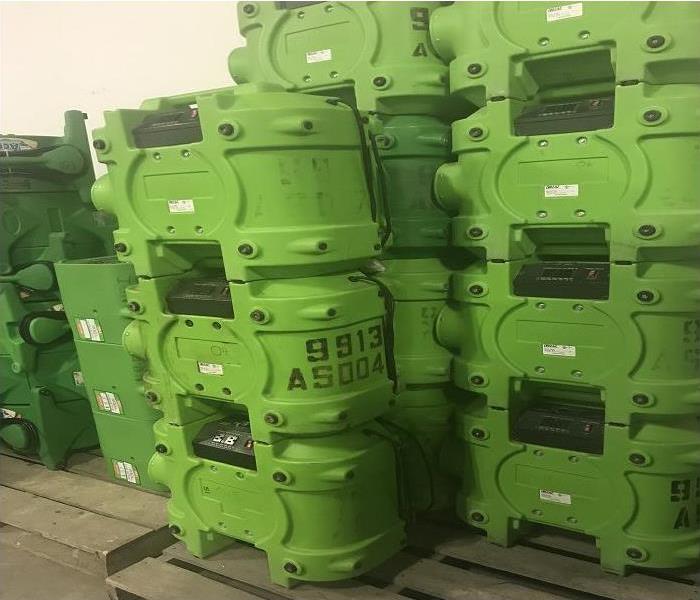 Stacked SERVPRO green air scrubbers 